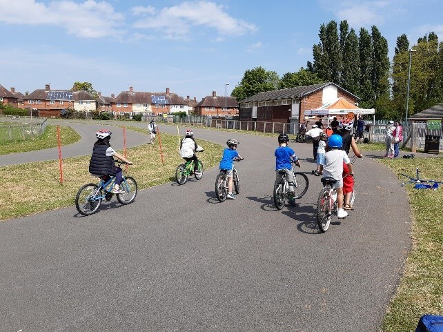 Children at a cycling event held by British Cycling