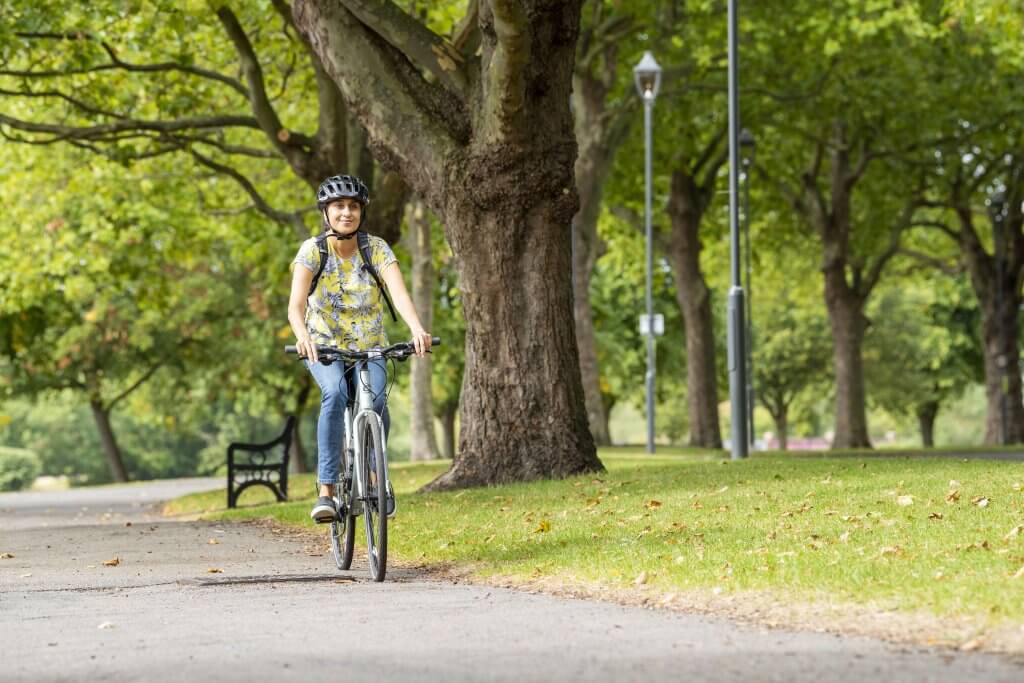 A woman cycling along the Victoria Embankment