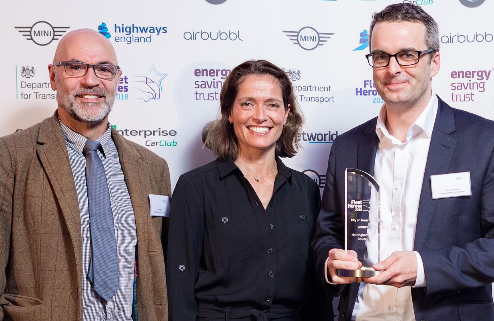 Senior Transport Planner Mark Daly and Transport Strategy Manager James Ashton are presented with the City Hero award by motoring journalist Amanda Stretton.