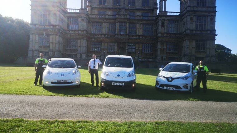 Three members of REACT with their electric vehicles