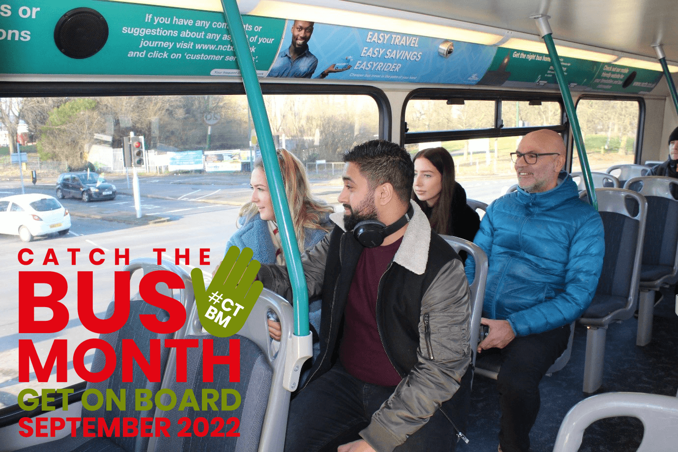 Passengers on a bus, with the Catch the Bus Month logo